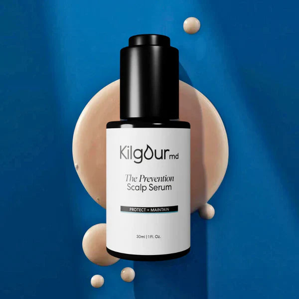 KilgourMD The Prevention Scalp Serum bottle with black pump, white label; beige serum droplets on blue background
