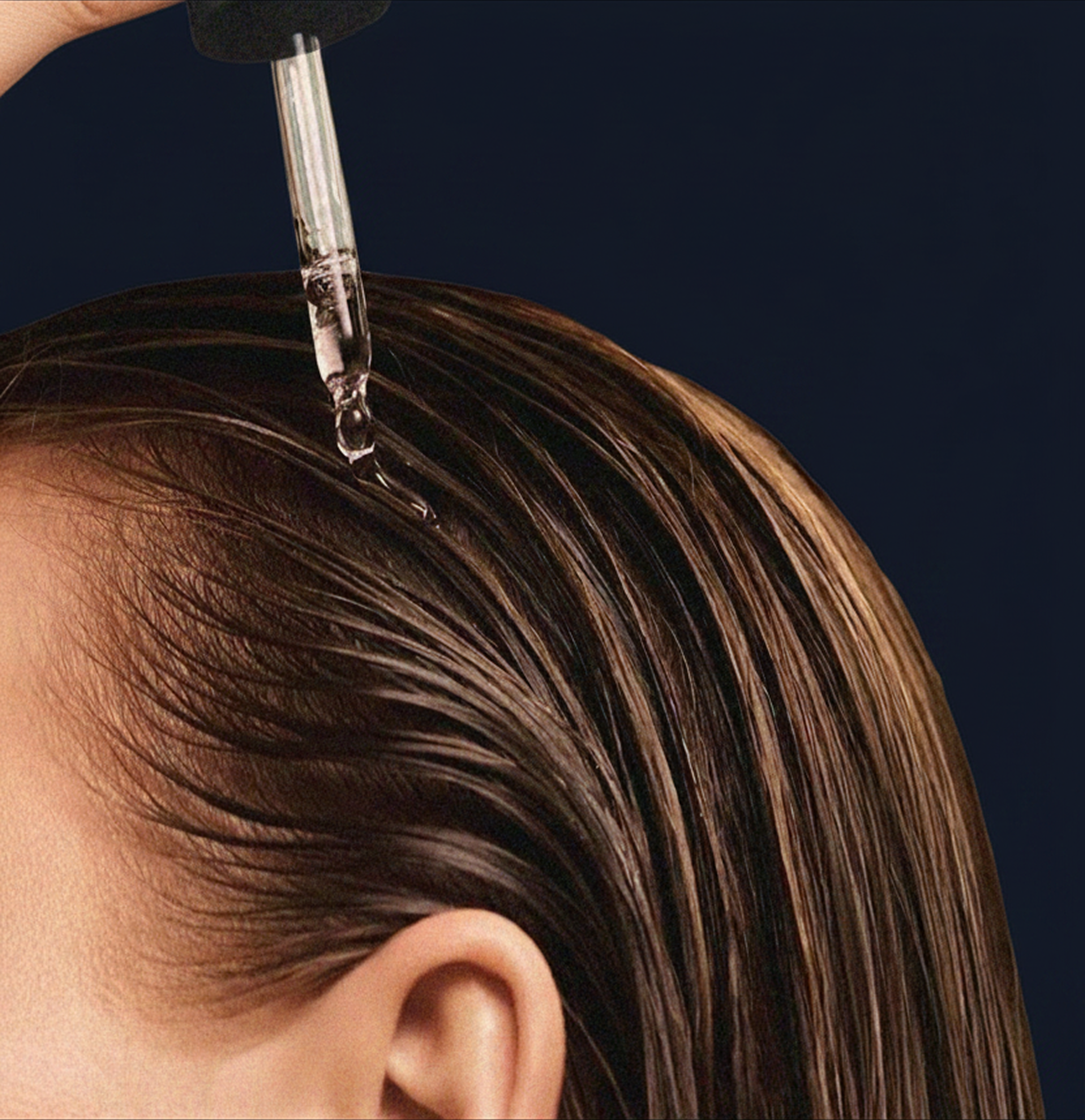 Serum applied to scalp with dropper